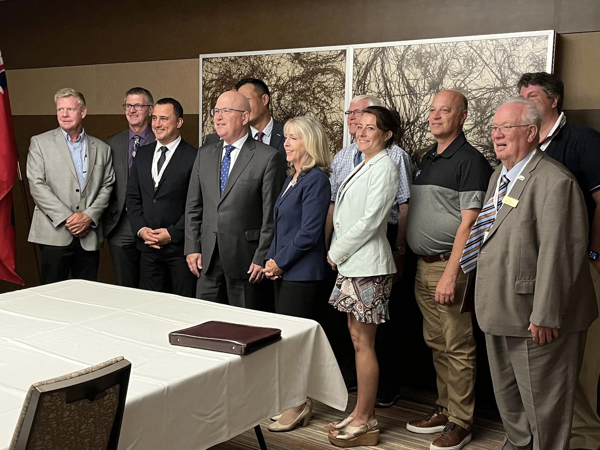 A photo op at the AMO convention featuring MPP Holland, Minister Michael Parsa, Minister Steve Clark, and other dignitaries. The image captures a moment of collaboration and strategic planning for municipal progress and community development.