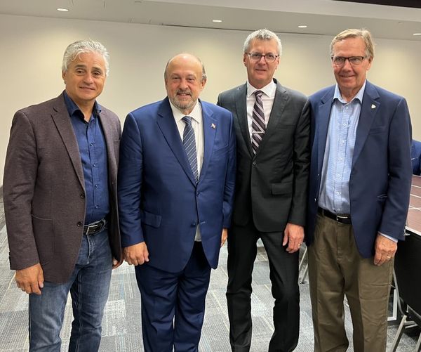 A photo at the AMO convention featuring MPP Holland alongside municipal leaders. The image reflects a collaborative spirit and a commitment to building strong alliances for the benefit of local communities.
