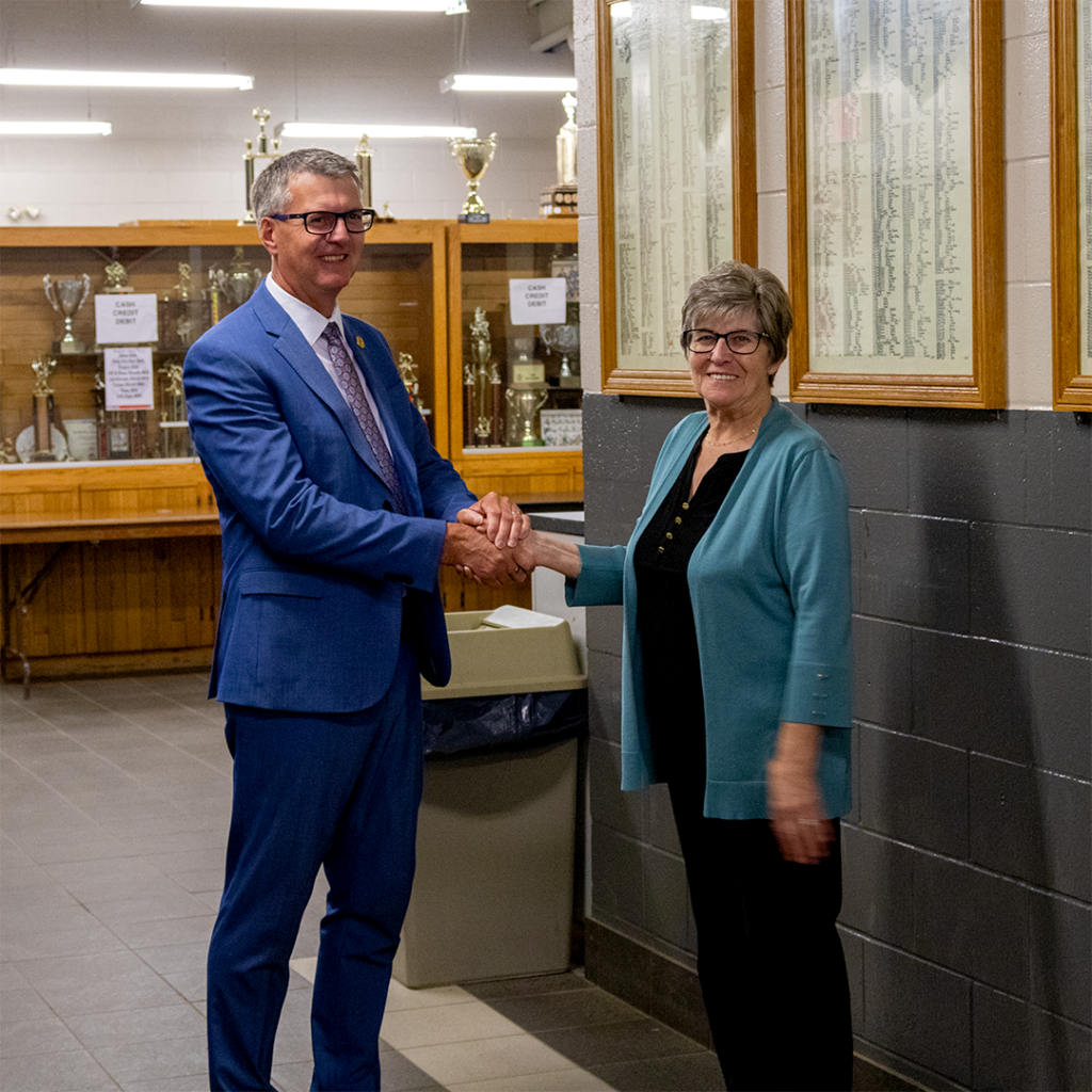 MPP Kevin Holland shaking hands with Mayor Lucy of Oliver Paipoonge at a public event. They are announcing new funding for the community, symbolizing a collaborative effort towards community improvement.